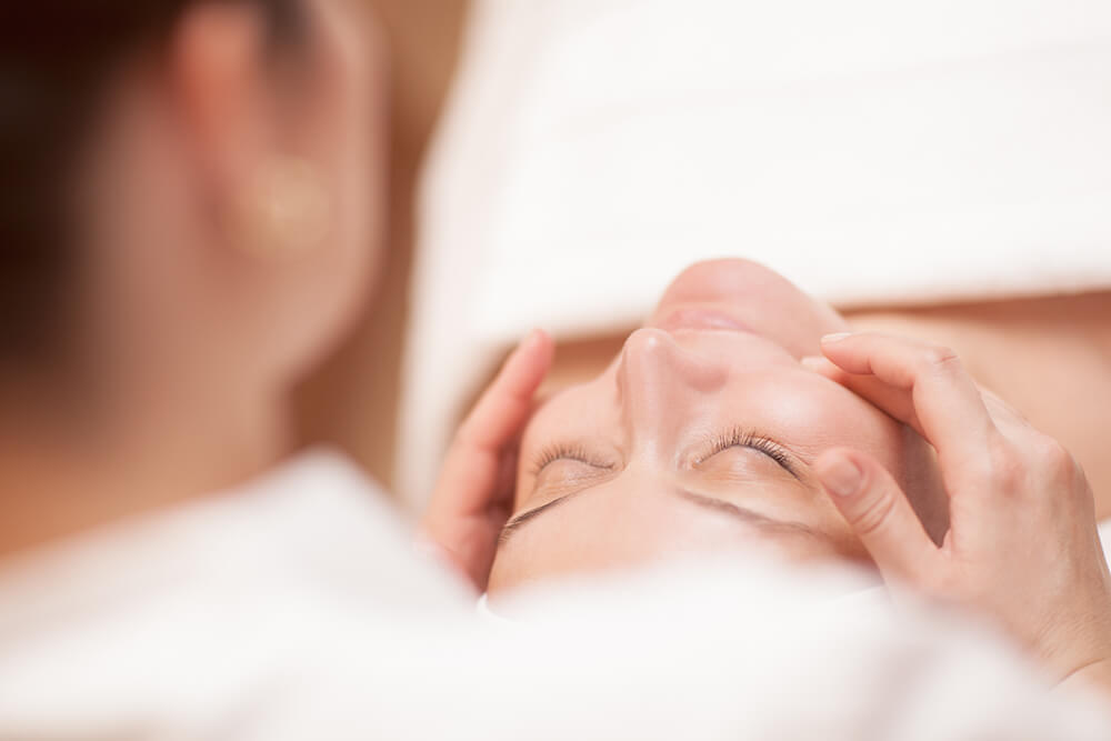 Woman getting a facial massage