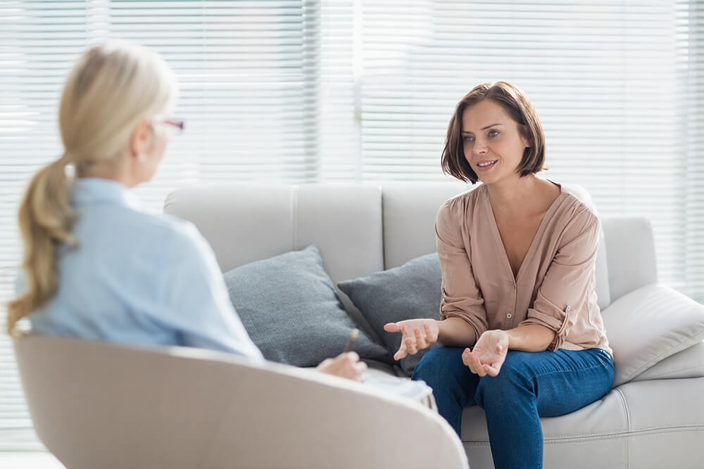 Psychiatrist talking with patient
